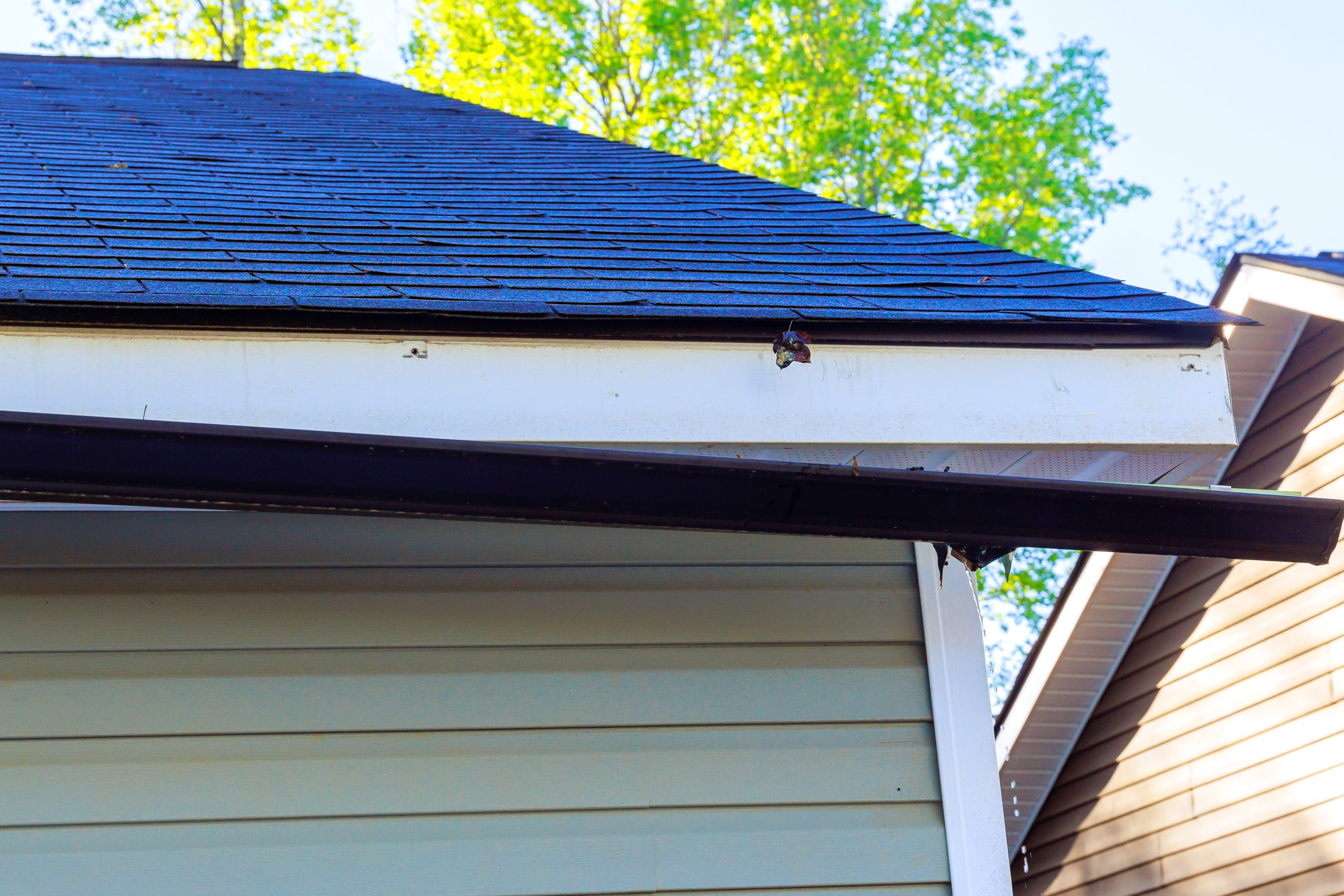 Broken gutter on garage