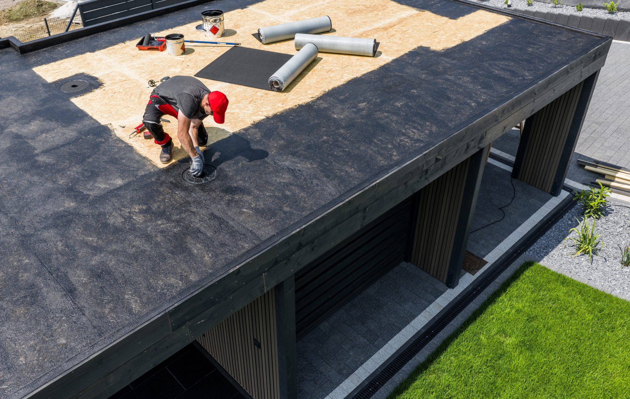 Roofer installing a new flat roof